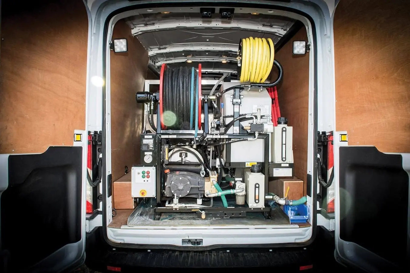 Professional high-pressure water jetting equipment installed inside a Drain Medics van, ready for emergency drain unblocking.