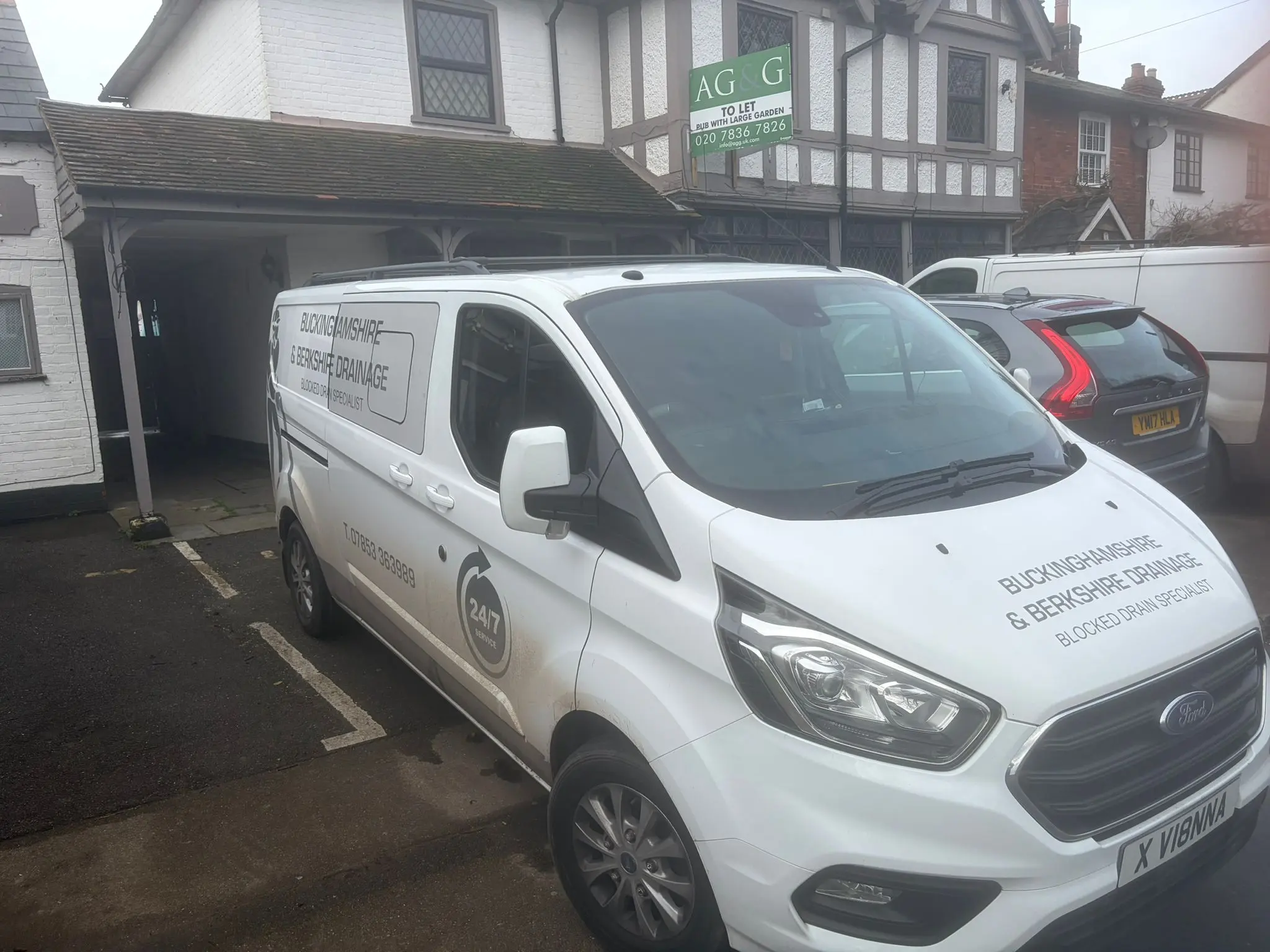 Buckinghamshire & Berkshire Drainage service van with 24/7 emergency branding parked in Slough.