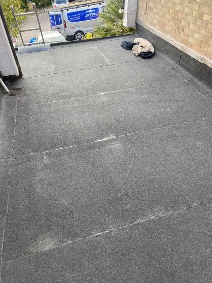 A grey felt flat roof installation on a residential property in Portsmouth, Hampshire.
