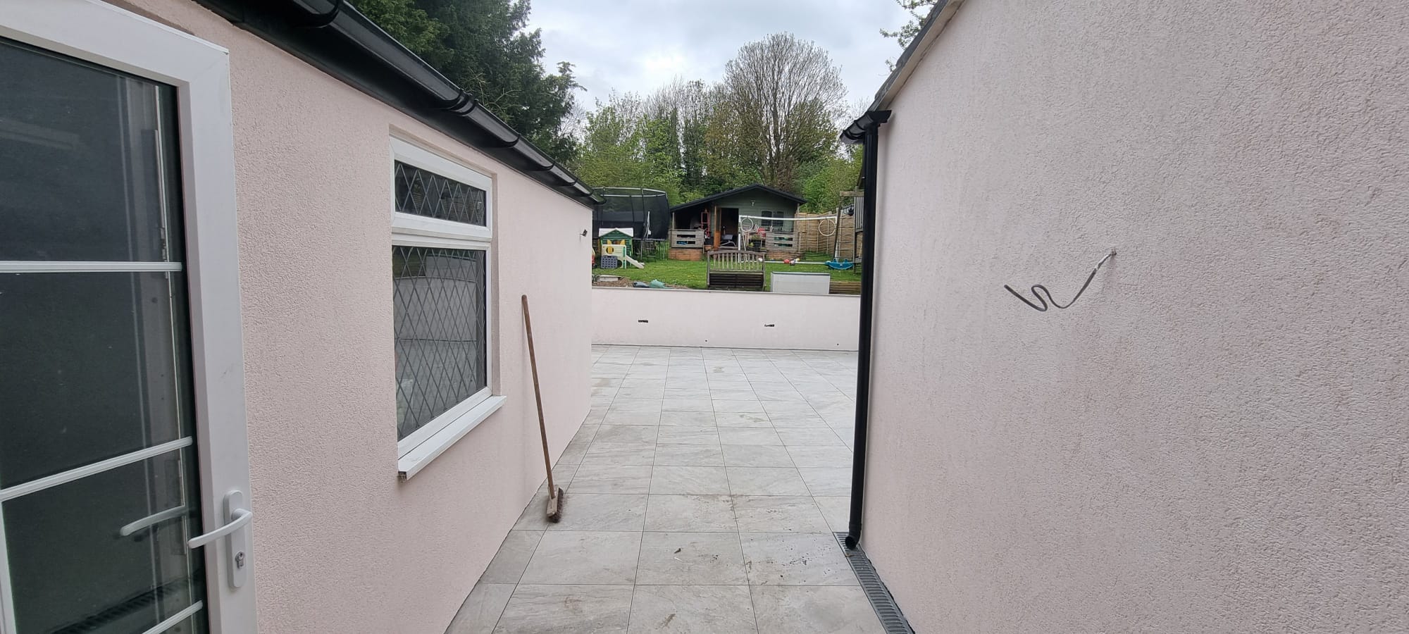 Professional external rendering on a house in Southwick, showing a clean and modern finish.