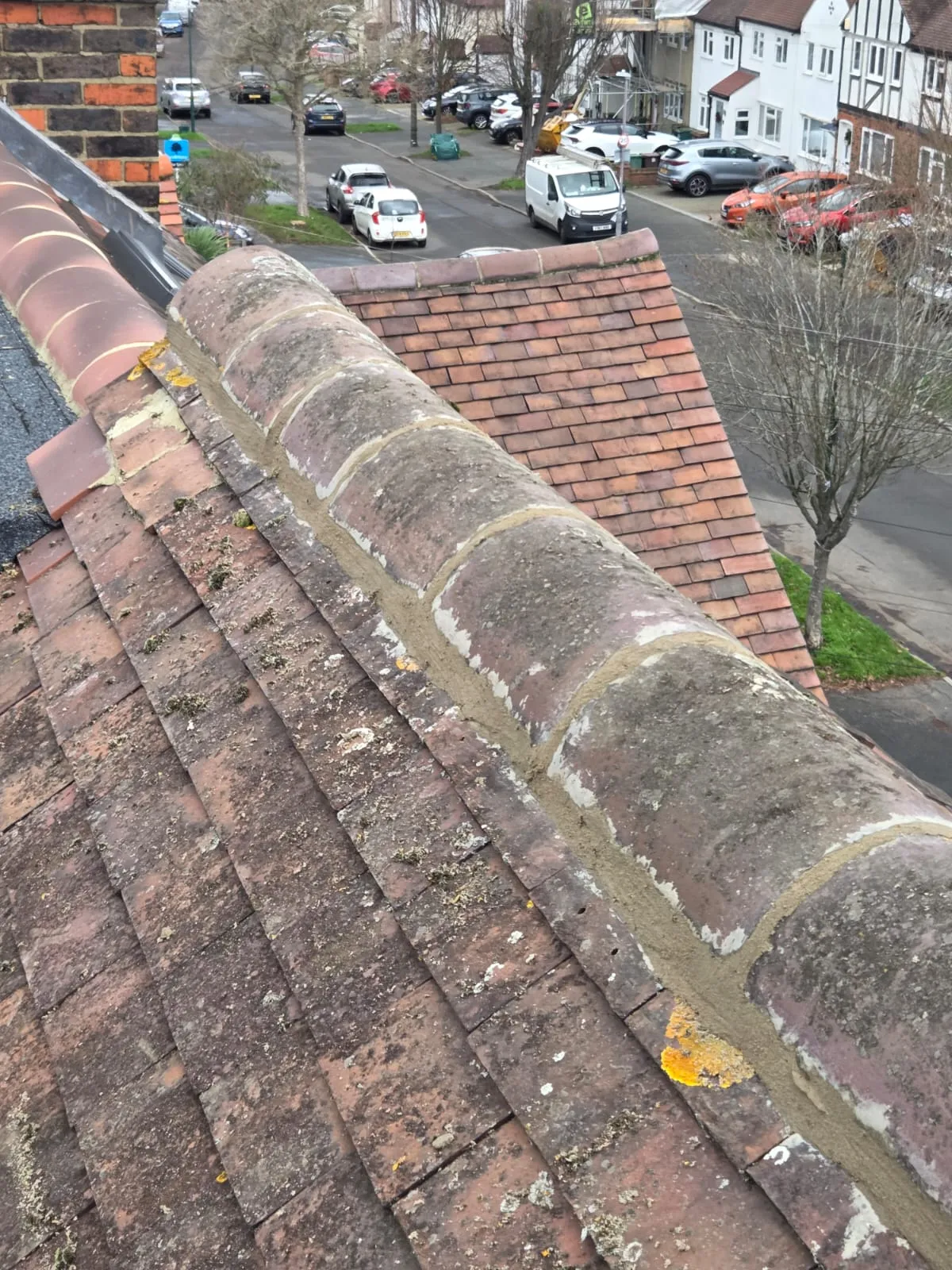 Tiled roof ridge tiles and mortar work on a residential house in Cornwall.