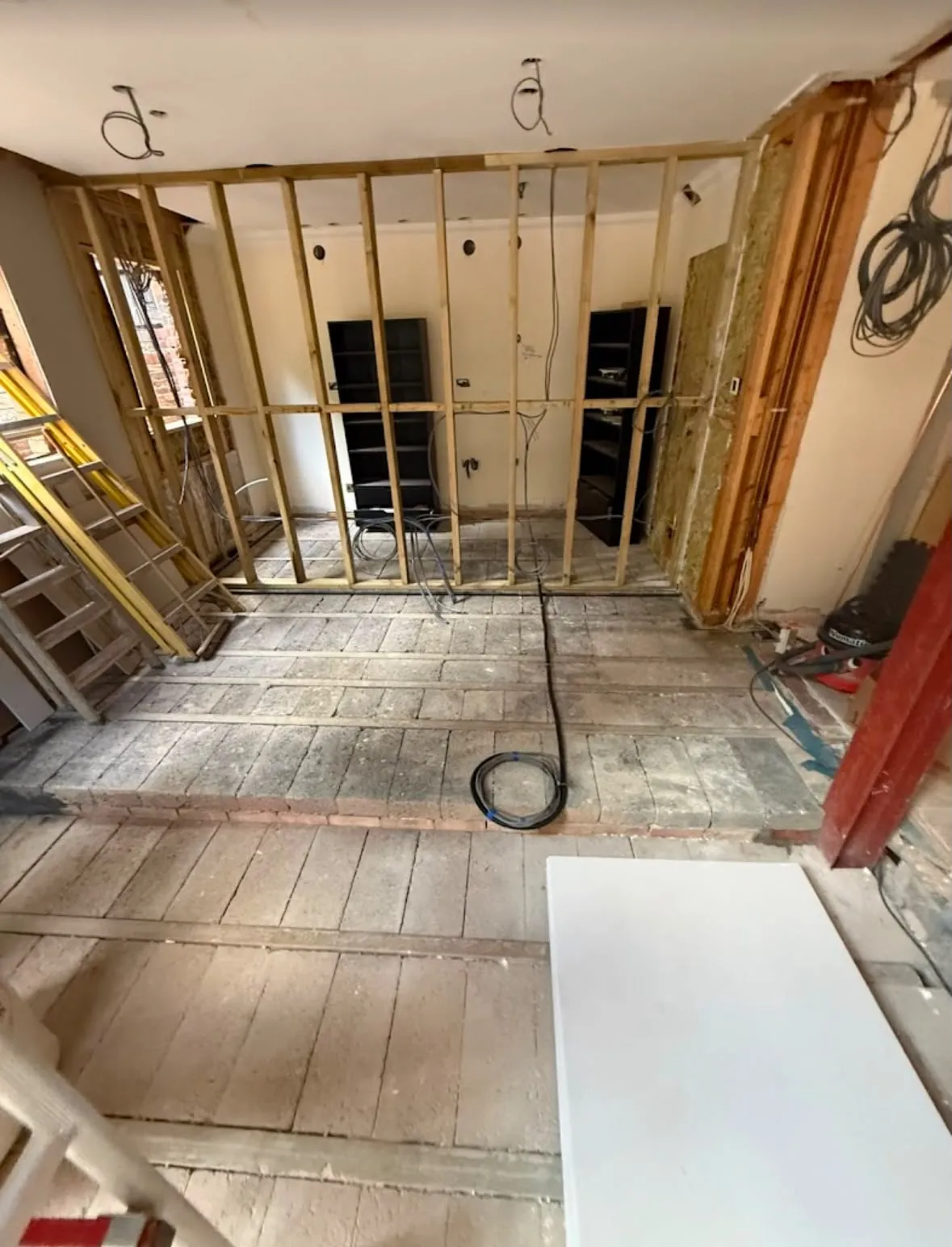 First-fix electrical cables and wiring installed through timber stud walls during a house rewire
