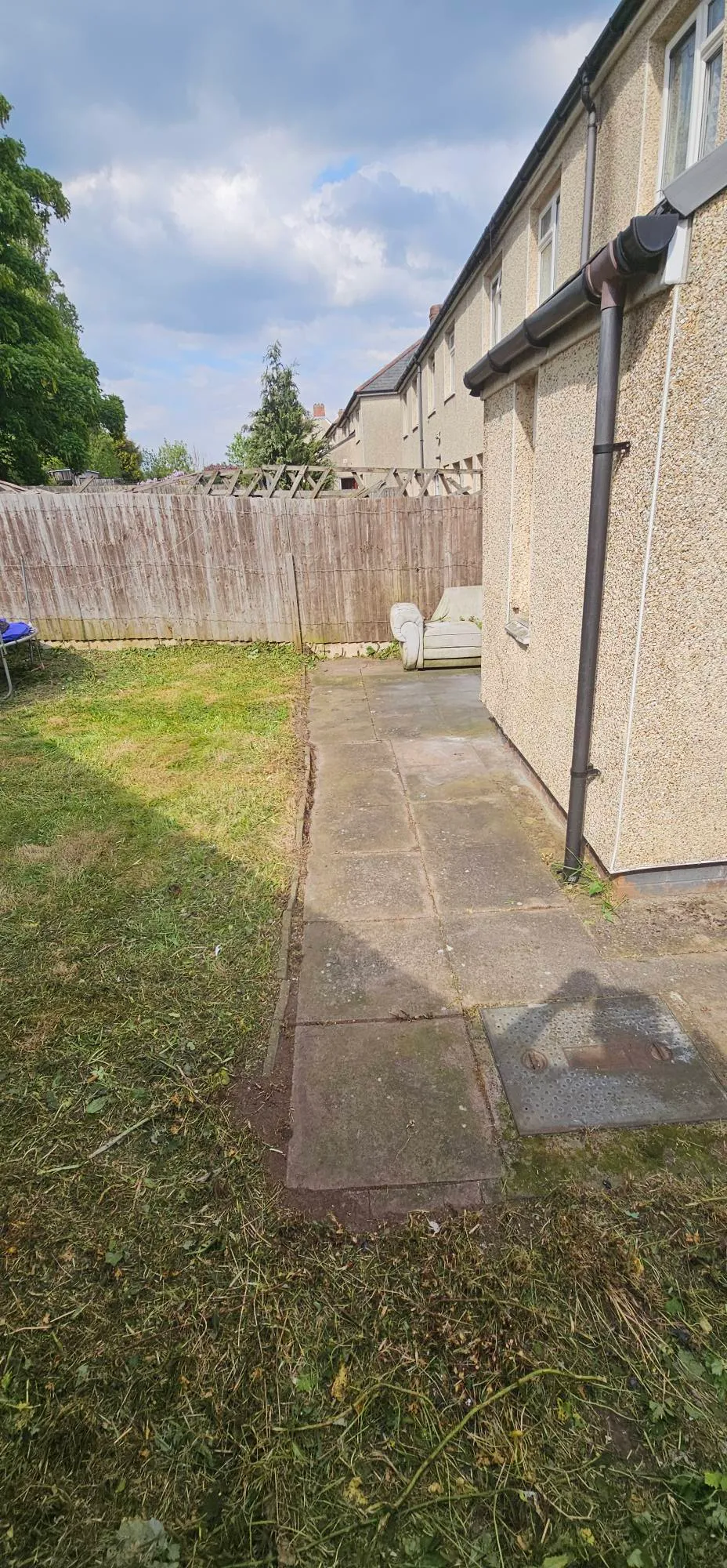 Cleared garden path and freshly cut lawn at a Birmingham residential property