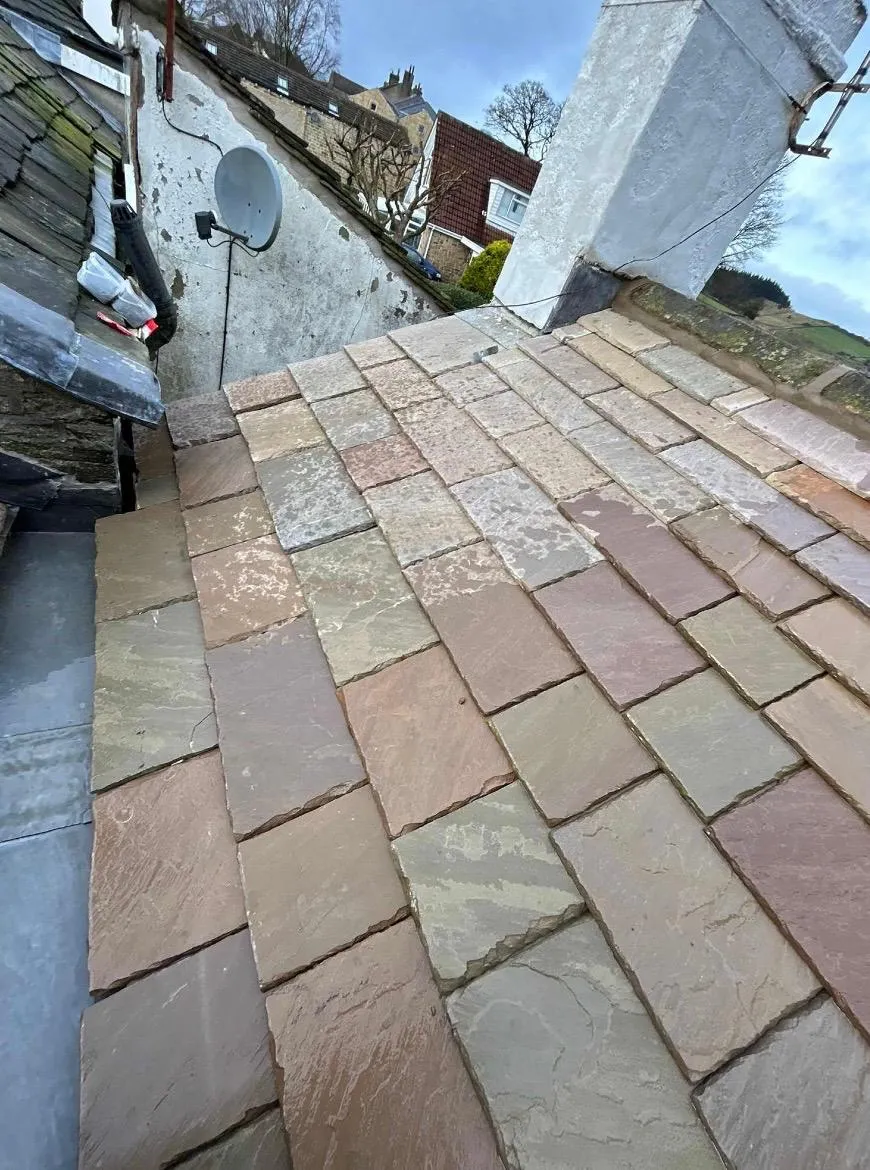 Heritage stone slate roofing installation in West Yorkshire by Tyler’s Roofing Services.