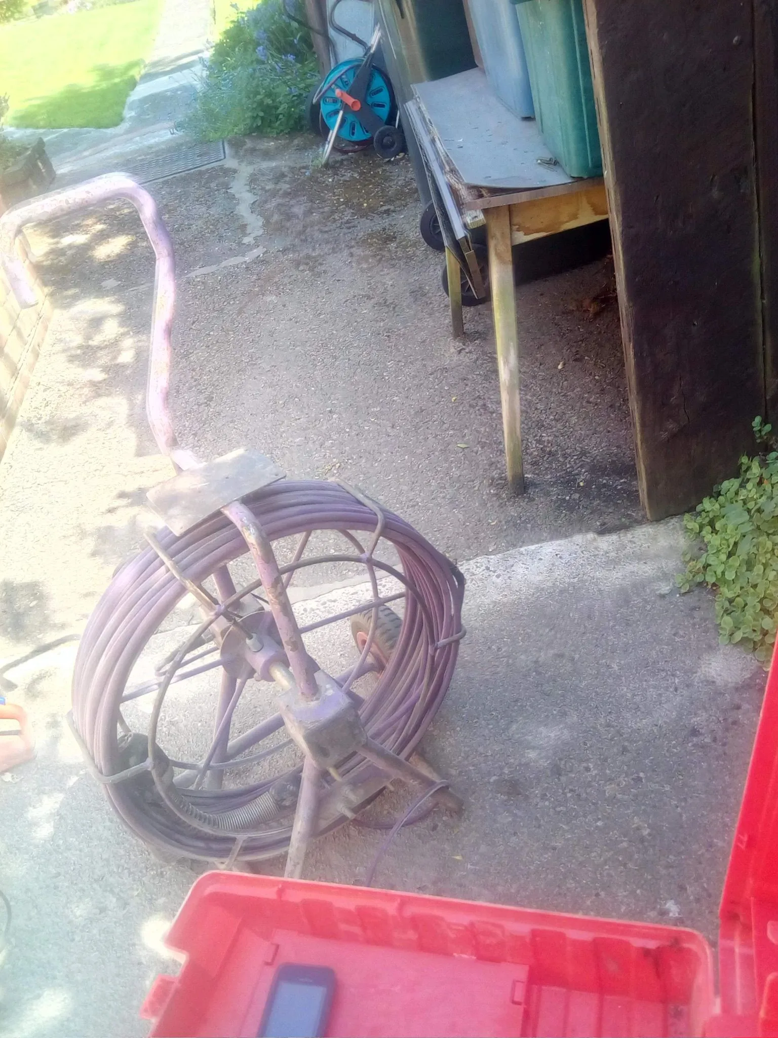 A professional drain survey camera cable reel and equipment for inspecting blocked pipes.