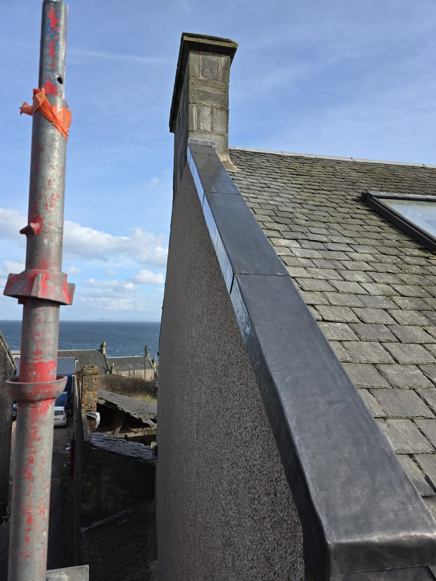 Professional leadwork and skew flashing on a traditional slate roof in Fife